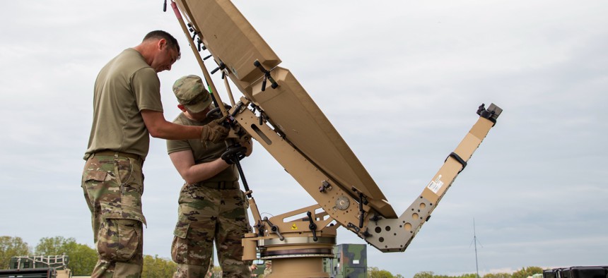 Air National Guardsmen set up a 2.4-meter satellite communications antenna at Camp Clark, Missouri, on April 23, 2024.