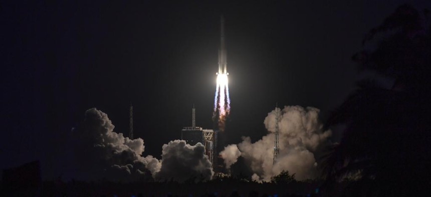 A Long March-7A rocket carrying the Shiyan-12 01 and Shiyan-12 02 satellites blasts off from the Wenchang Spacecraft Launch Site in south China on Dec. 23, 2021.
