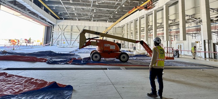 Issa Dioubate, U.S. Army Corps of Engineers Middle East District civil engineer, views progress on a maintenance facility, Mar. 25, 2025. The facility is part of a large-scale infrastructure project funded through Foreign Military Sales in the U.S. Central Command region.